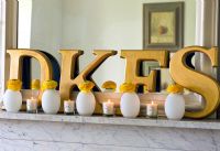Detail of decorative letters and candles 