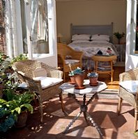 Garden furniture on terrace outside bedroom 