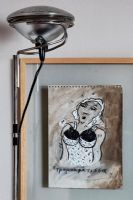 Framed sketch and lamp