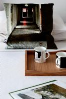 Wooden tray on bed