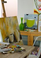 Artists studio with still life painting on easel