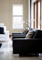 Contemporary black leather armchairs