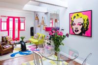 Open plan dining room with Warhol's Marilyn Monroe print