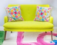 Embroidered cushions on Designers Guild sofa