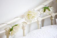 Fake Roses wound around bedstead