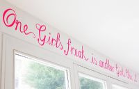 Pink lettering above window