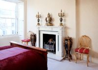 Fireplace in classic bedroom