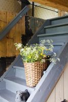 Basket of flowers on stairs