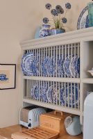 Willow pattern plates in rack