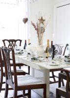 Modern dining room decorated for Christmas meal