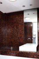 Contemporary bathroom with brown mosaic tiles