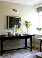 Wooden console table in country hallway