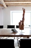Dining table with driftwood sculpture
