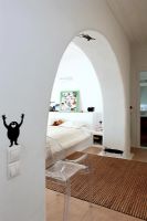 Modern white bedroom with arch