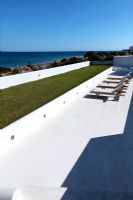 Loungers on terrace with sea view
