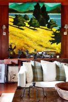 Painting of rural scene in living room