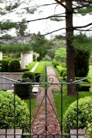 View through iron gate to country garden