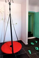 Red swing in childs room