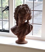 Terracotta bust on window sill