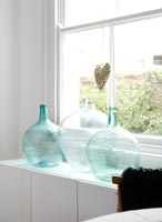 Glass bottles on windowsill