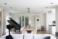 Open plan living space with piano