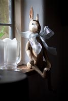 Wooden bunny on windowsill