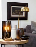 Vases and lamps on side table