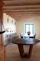 Country dining room with vintage wooden round table