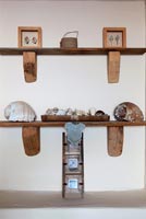 Wooden shelves with shells and ornaments