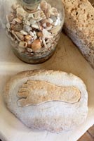 Decorative stone and jar of sea shells