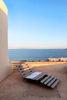 Wooden lounger and sea views, Paros, Greece