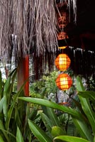 Outdoor lights hanging from wooden porch