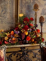 Arrangement of flowers and seasonal fruits