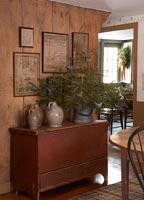 Sideboard in country dining room with Christmas tree
