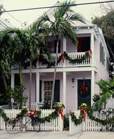 Clapboard house decorated for Christmas