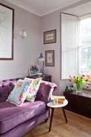 Purple sofa and vintage coffee table