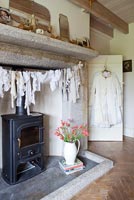 Vintage clothing hanging by stove