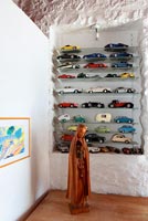 Glass shelves with miniature cars