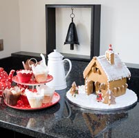 Christmas cakes and pastries on kitchen counter