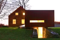Converted farmhouse lit up