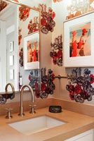 Modern bathroom sink with floral wallpaper