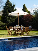 Garden furniture by swimming pool