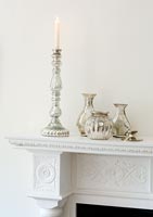 Silver items on mantlepiece