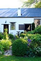 White cottage and garden