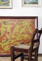 Rustic wooden chair and modern painting