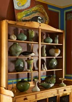 Wooden cabinet with pottery display