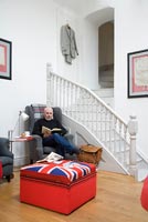 Nigel Stendgaard-Green relaxing in his living room