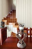Modern staircase into dining room