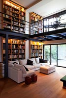 Contemporary open plan living room under mezzanine
