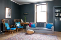 Grey living room with retro armchairs